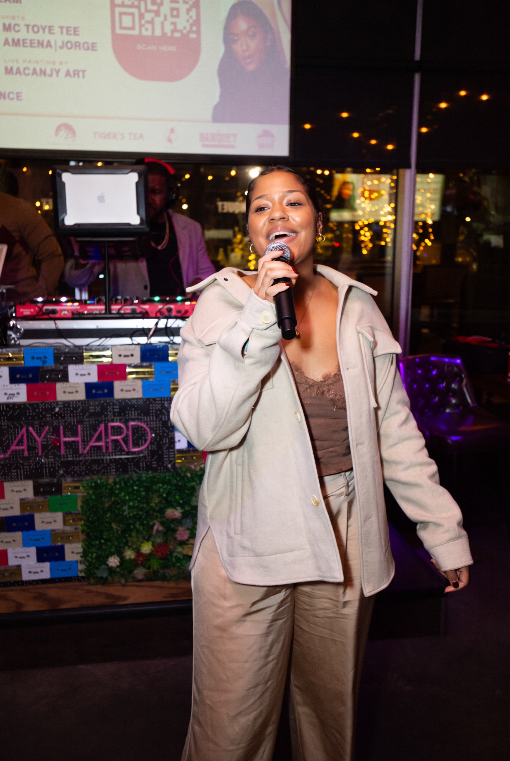 Ezeada performing live with a microphone